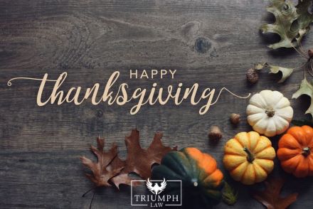 pumpkins on a table with "Happy Thanksgiving" text