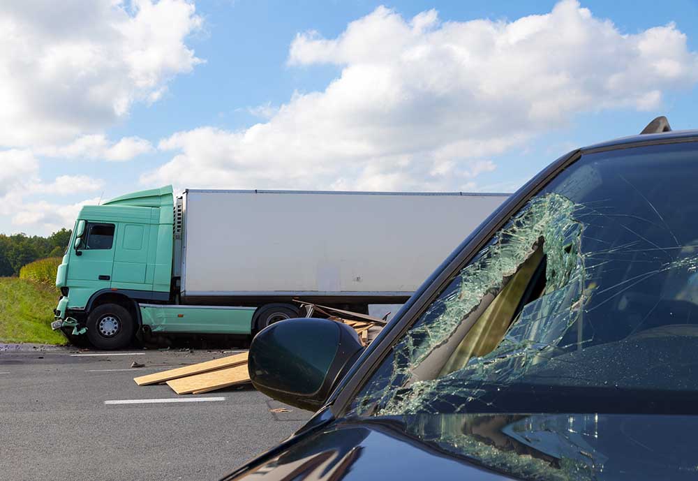 a-damaged-car-and-a-commercial-truck-after-a-truck-accident