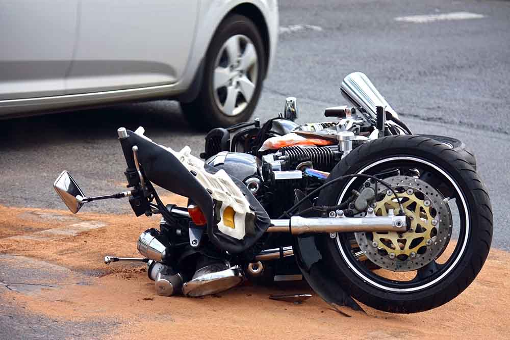 a-damaged-motorcycle-lying-in-the-road-after-a-motorcycle-accident