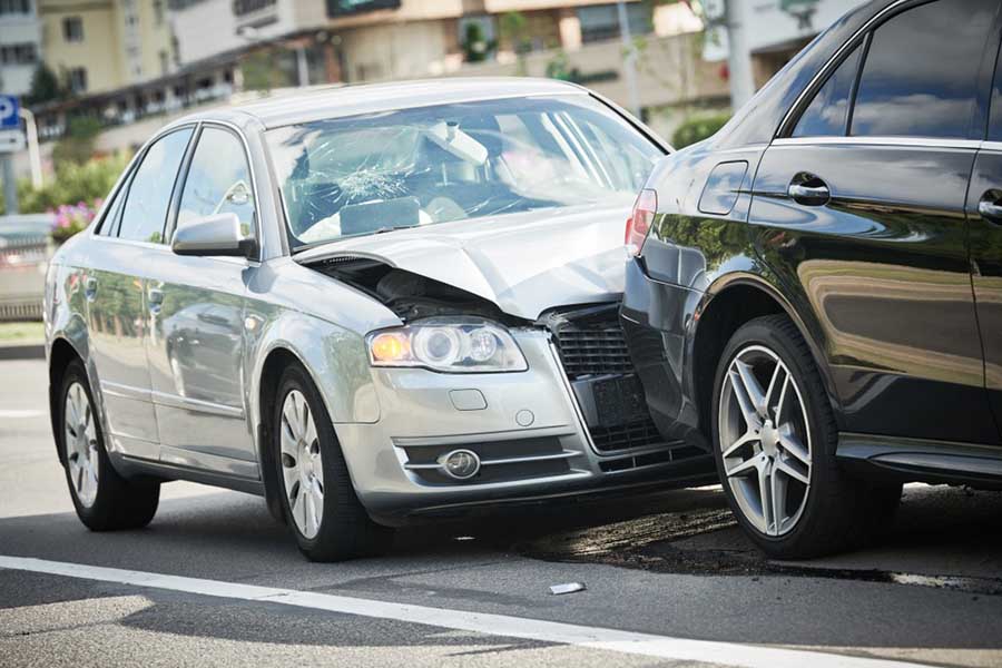 Two Damaged Vehicles Following A Car Accident