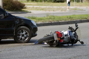 motorcycle and car after crash