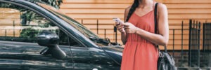 woman using rideshare app for a ride